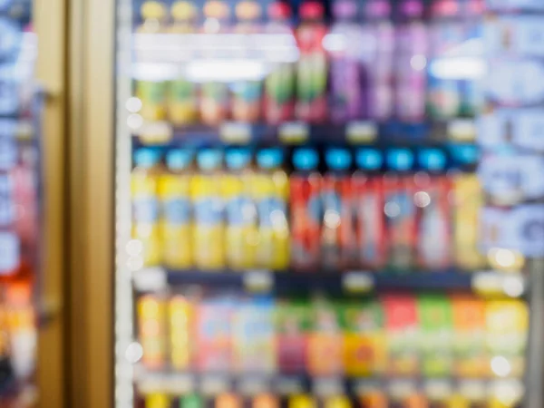 supermarket refrigerator shelves with drinks beverage products