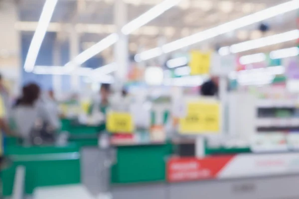 Blur cashier checkout counter in the supermarket