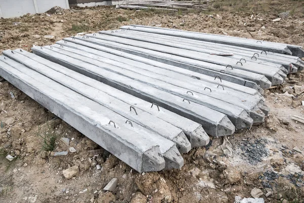 Concrete piles on ground for house construction foundation — Stock Image Concrete Piles Ground House Construction Foundation Stock Image