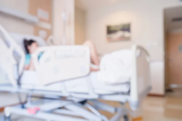 Abstract blur Patient on bed in Hospital Room interior for background