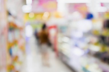 Soyut bulanık süpermarket indirimli mağaza koridoru ve ürün rafları iç odaklanmış arka plan