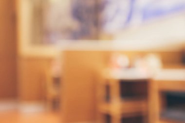 Bokeh ışıkları odaklı bulanık kafeterya restoranı.