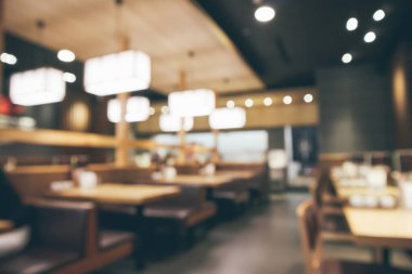Bokeh ışıkları odaklı bulanık kafeterya restoranı.