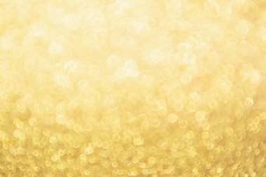 Soyut Altın Işıltılı Noel arkaplanı Bokeh ışığı ile bulanıklaşıyor