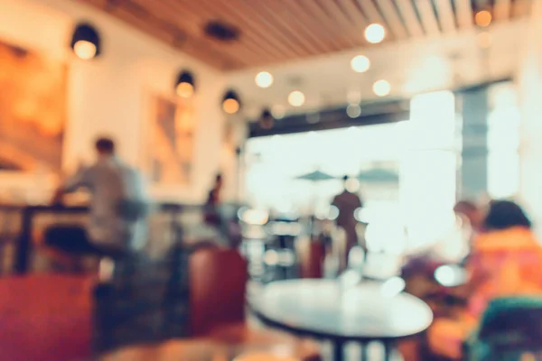 Restaurant cafe or coffee shop interior with people abstract defocused blur background