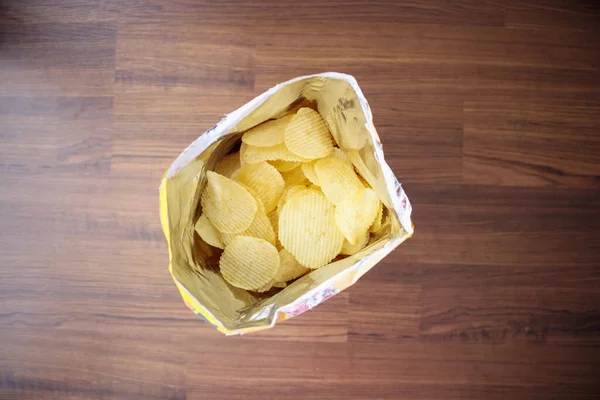 Potato Chips Open Snack Bag Close Table Floor — Stock Photo, Image