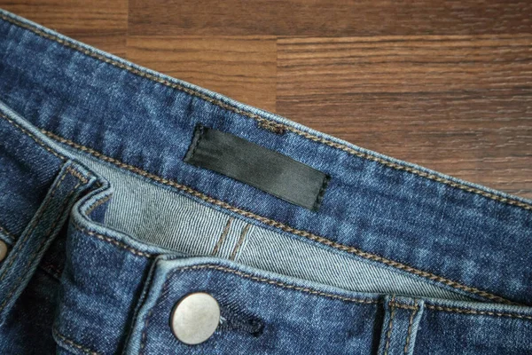 Blue jeans with blank clothing label tag
