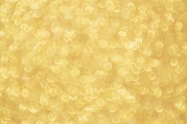 Soyut Altın Işıltılı Noel arkaplanı Bokeh ışığı ile bulanıklaşıyor