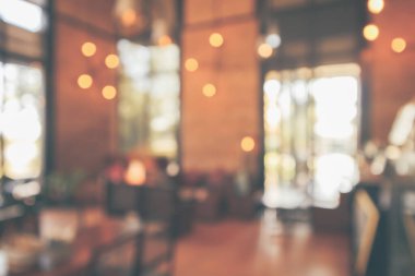 Montaj ürün görüntüleme arka planı için müşteri bulanıklığı olan restoran kafesi ya da kahve dükkânı içi soyut vintage bokeh ışığı