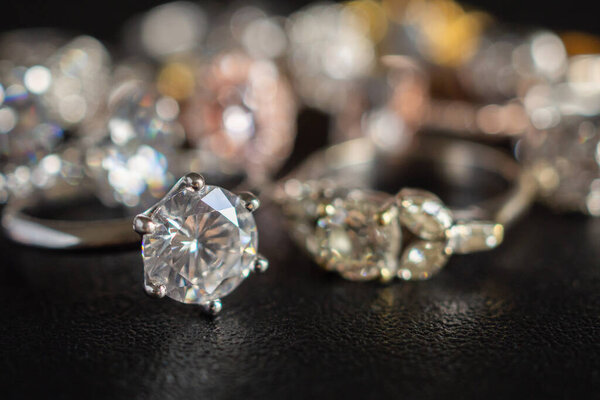 Jewelry diamond rings set on black background close up