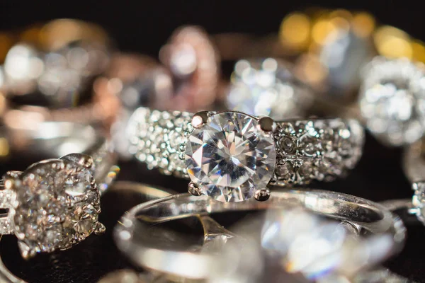 Jewelry diamond rings set on black background close up