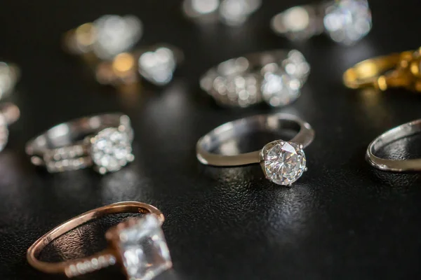 Jewelry diamond rings set on black background close up