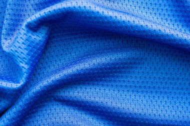 Mavi renk kumaş, spor kıyafetleri, futbol forması, hava ağı desenli arka plan.