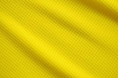 Sarı renkli futbol forması kumaş kumaş kumaş spor giysisi arka plan, yakın çekim