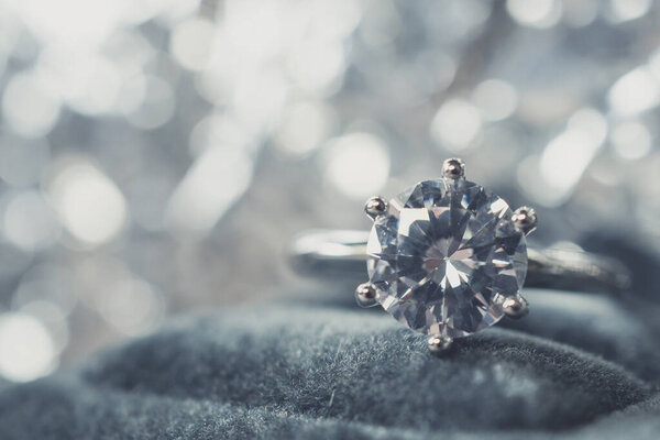 luxury engagement Diamond ring with abstract bokeh light background