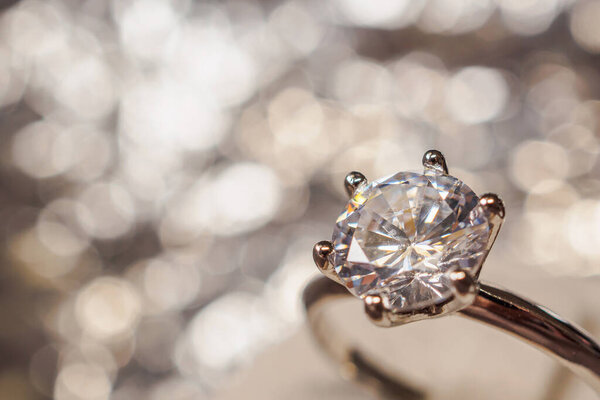 luxury engagement Diamond ring with abstract bokeh light background