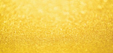 Soyut Altın Işıltılı Noel arkaplanı Bokeh ışığı ile bulanıklaşıyor