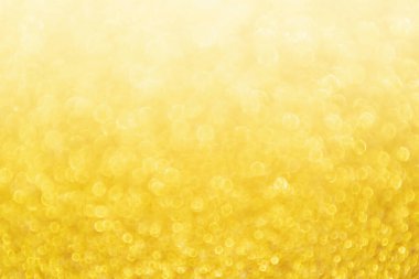 Soyut Altın Işıltılı Noel arkaplanı Bokeh ışığı ile bulanıklaşıyor