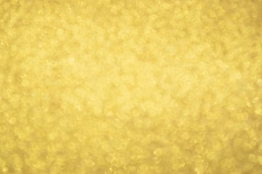 Soyut Altın Işıltılı Noel arkaplanı Bokeh ışığı ile bulanıklaşıyor
