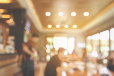 Montaj ürün görüntüleme arka planı için müşteri bulanıklığı olan restoran kafesi ya da kahve dükkânı içi soyut vintage bokeh ışığı