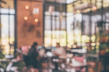 Montaj ürün görüntüleme arka planı için müşteri bulanıklığı olan restoran kafesi ya da kahve dükkânı içi soyut vintage bokeh ışığı
