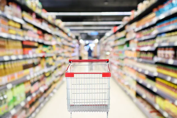 Carrito Compras Vacío Con Desenfoque Abstracto Supermercado Descuento Tienda Pasillo —  Fotos de Stock