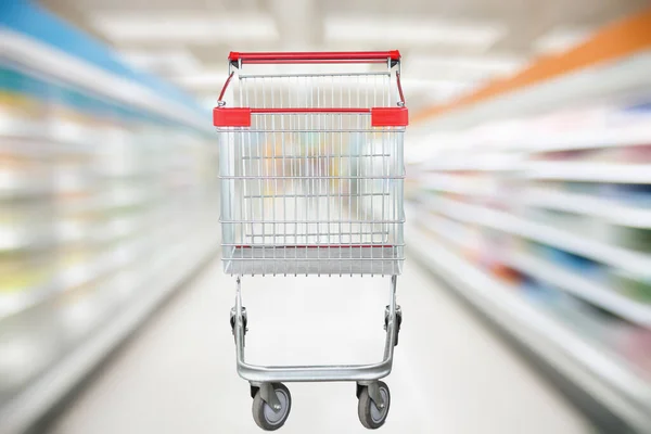 Supermarket Ulička Rozostřené Pozadí Prázdným Červeným Nákupním Vozíkem — Stock fotografie