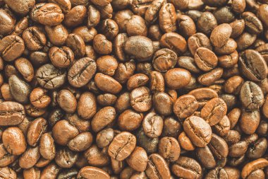 Kavrulmuş kahve çekirdekleri yakından doku arka planı.