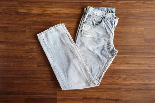 Jeans Blu Denim Fondo Legno — Foto Stock