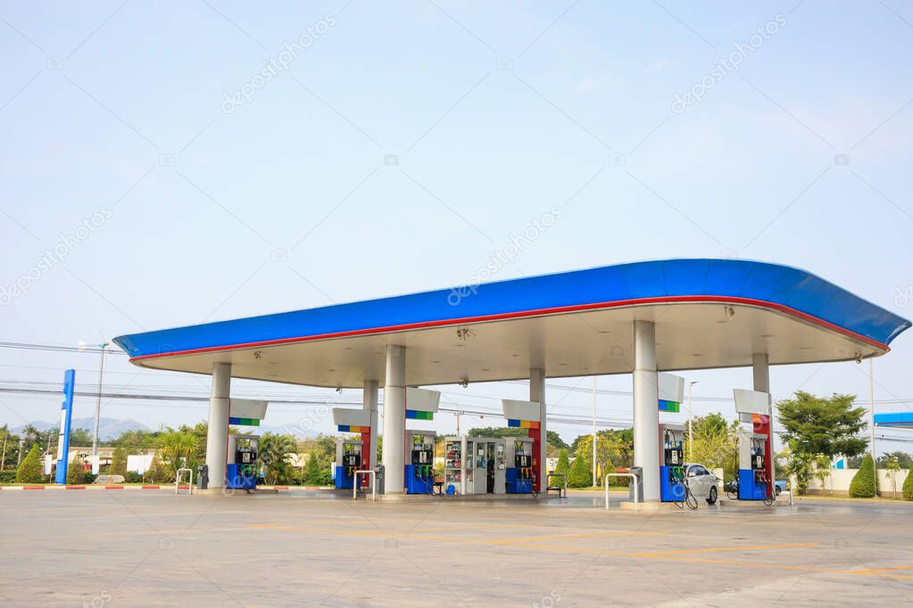 Petrol gas fuel station with clouds and blue sky