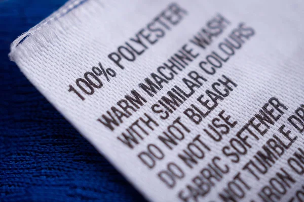 Etiqueta Ropa Poliéster Con Instrucciones Cuidado Ropa Etiqueta Camiseta Azul — Foto de Stock