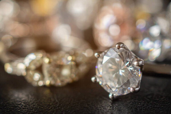 Jewelry diamond rings set on black background close up