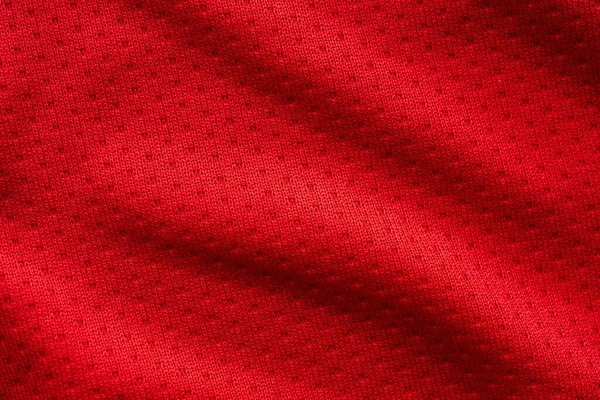有空气网纹理背景的红色面料运动服足球球衣 — 图库照片