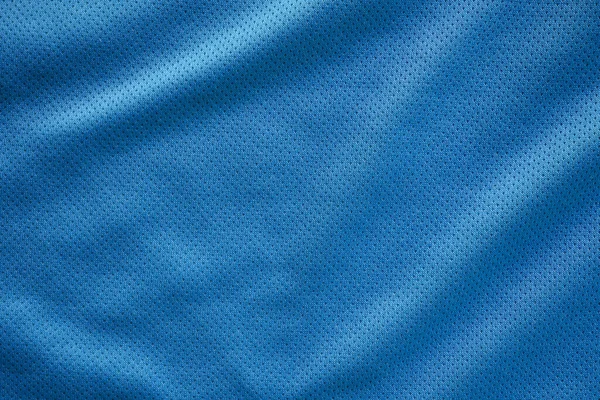 有空气网纹理背景的蓝色面料运动服足球球衣 — 图库照片