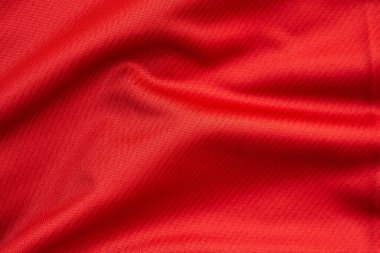 Kırmızı spor giysi, futbol forması kumaşı, yakın çekim.