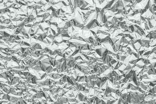 Shiny metal silver gray foil crumpled texture background