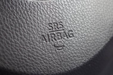 Safety airbag sign on car steering wheel with horn icon clipart