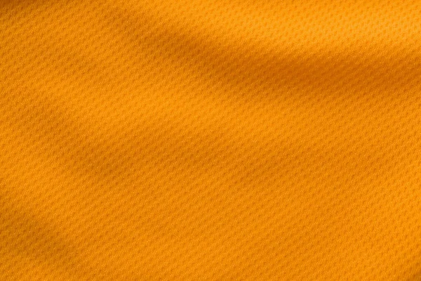 オレンジのスポーツウェアファブリックジャージサッカーシャツテクスチャトップビュー — ストック写真