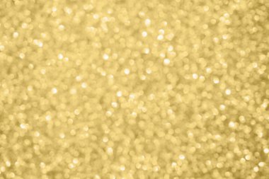 Soyut bulanık altın parıltısı parlaklığı odaklanmış bokeh ışık arkaplanı