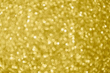 Soyut bulanık altın parıltısı parlaklığı odaklanmış bokeh ışık arkaplanı