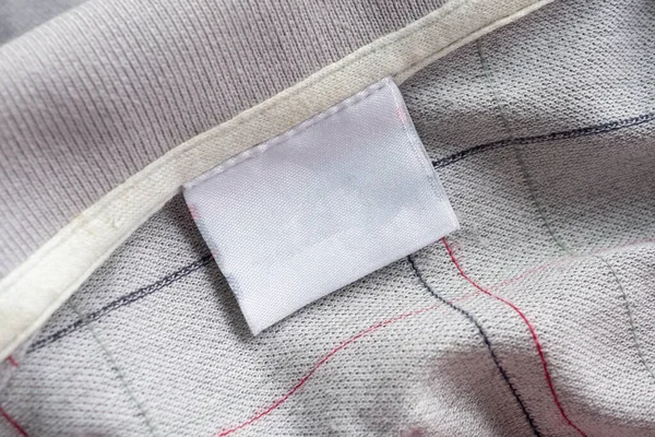 laundry care clothing label on fabric texture