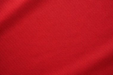 Kırmızı spor giysi, futbol forması kumaşı, yakın çekim.