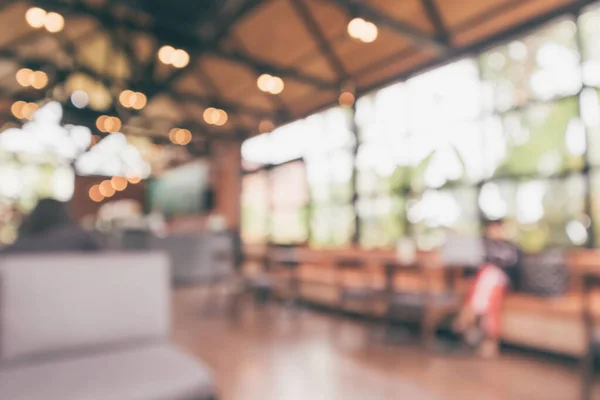 Cafe coffee shop interior abstract blur defocused with bokeh light background