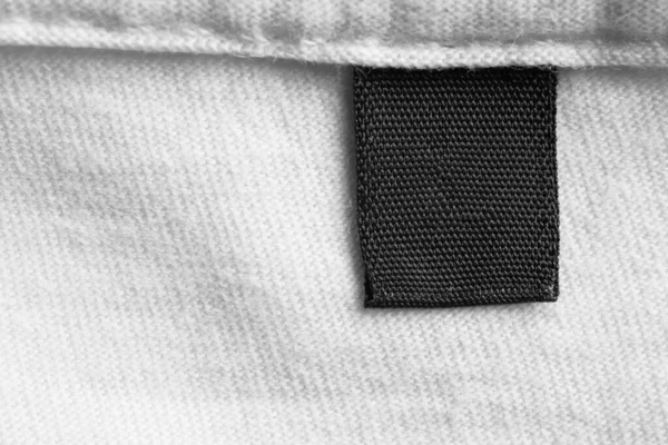 Zwart Blanco Wasgoed Zorg Kleding Label Witte Katoen Shirt Achtergrond — Stockfoto