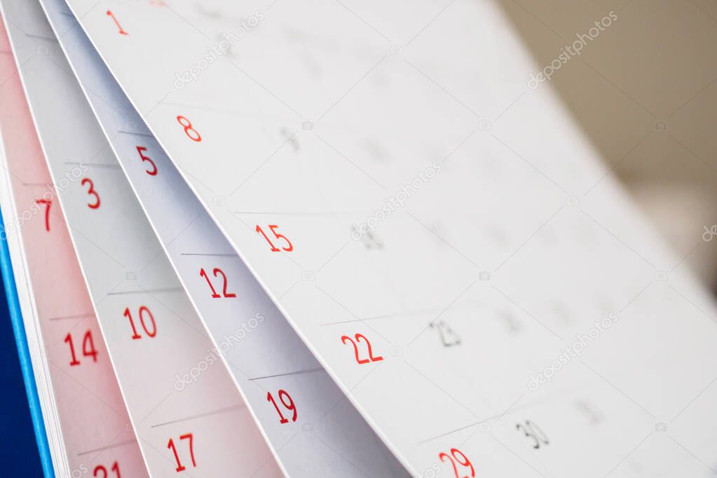 Calendar page flipping sheet close up on office table background business schedule planning appointment meeting concept