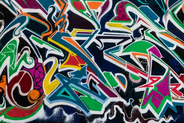 colourful abstract graffiti tag on a public wall texture