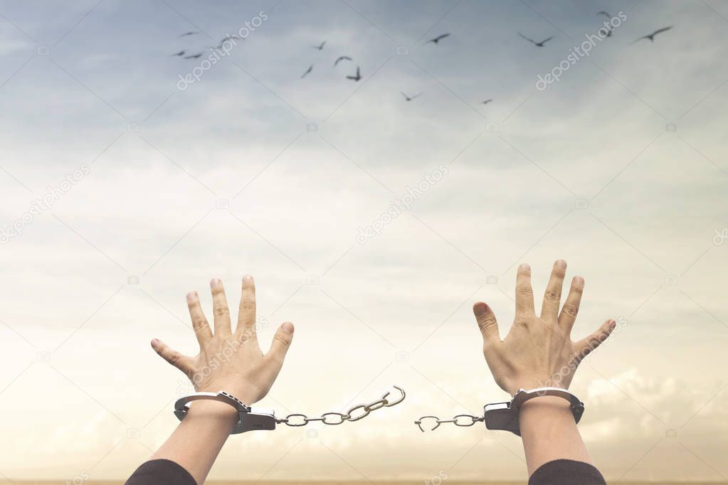 concept of freedom with a pair of open handcuffs