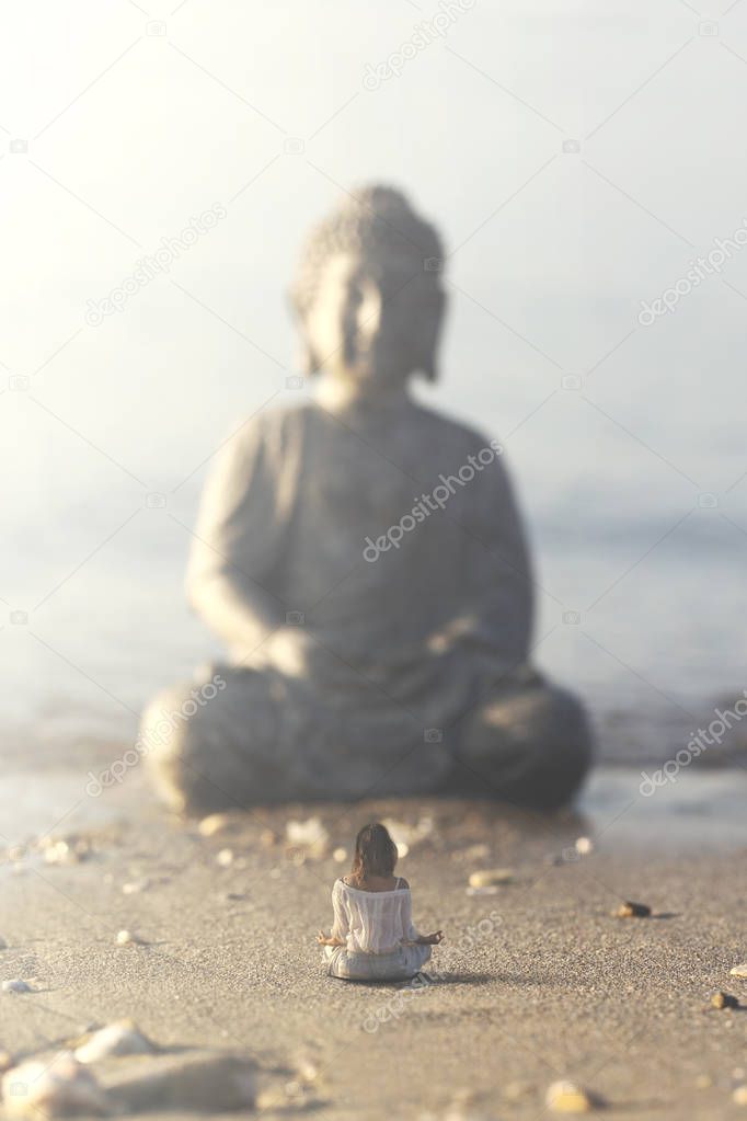 woman makes yoga exercises in front of the Buddha statue