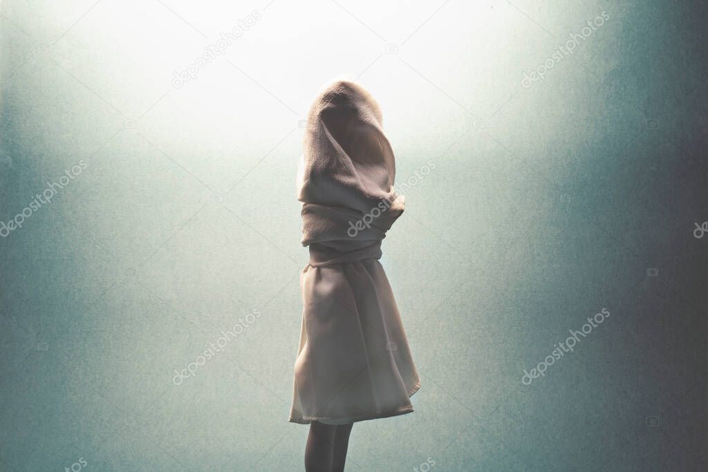 woman tied and hidden by a white veil