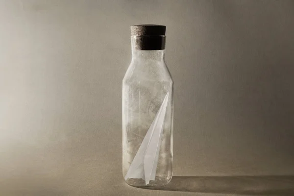 paper plane enclosed in a bottle, need freedom to fly